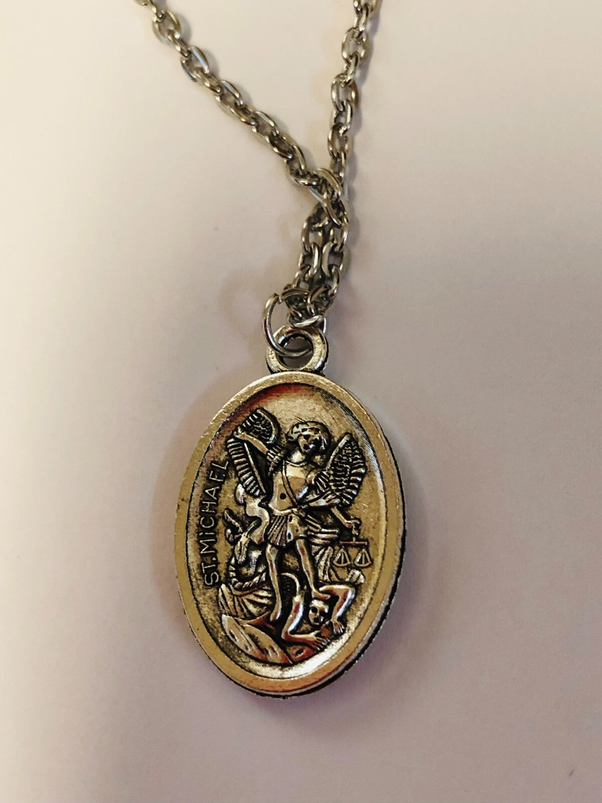 Two-sided Saint Michael the Archangel guardian angel necklace pendant, unbranded fashion jewelry, detailed religious medal design.