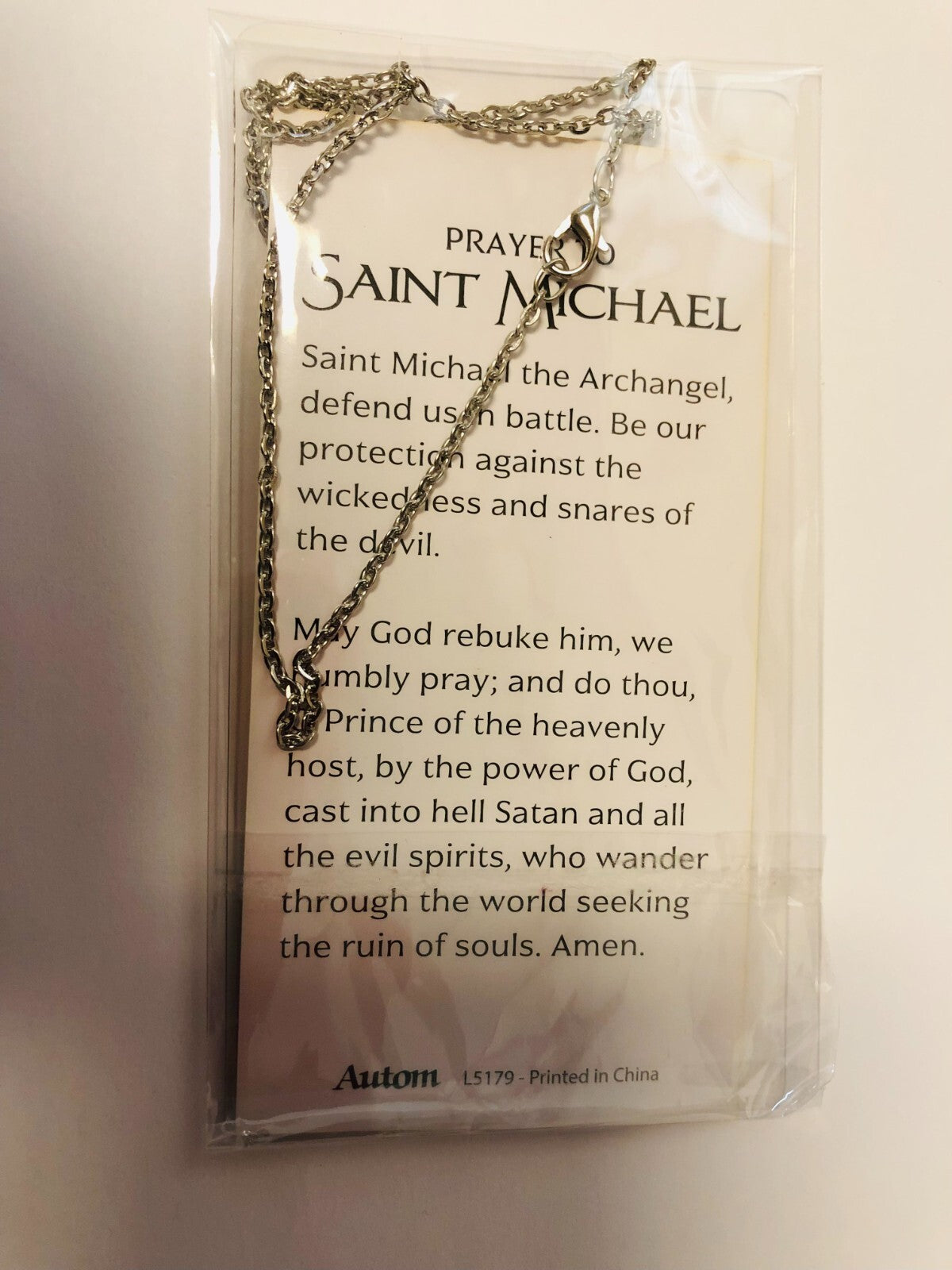 Two-sided Saint Michael the Archangel guardian angel medal necklace, unbranded fashion jewelry pendant with detailed religious imagery.