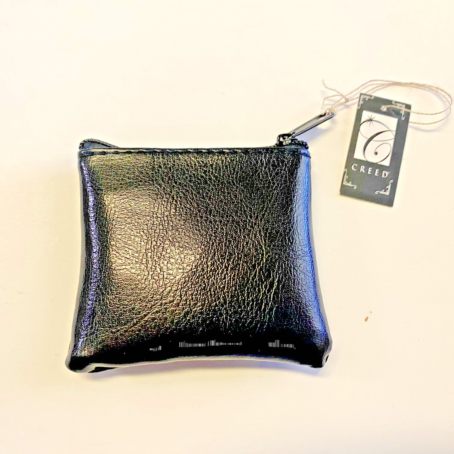 Black leather rosary pouch with embossed detailing, designed for Christian rosaries, from Bob and Penny Lord Journeys of Faith.