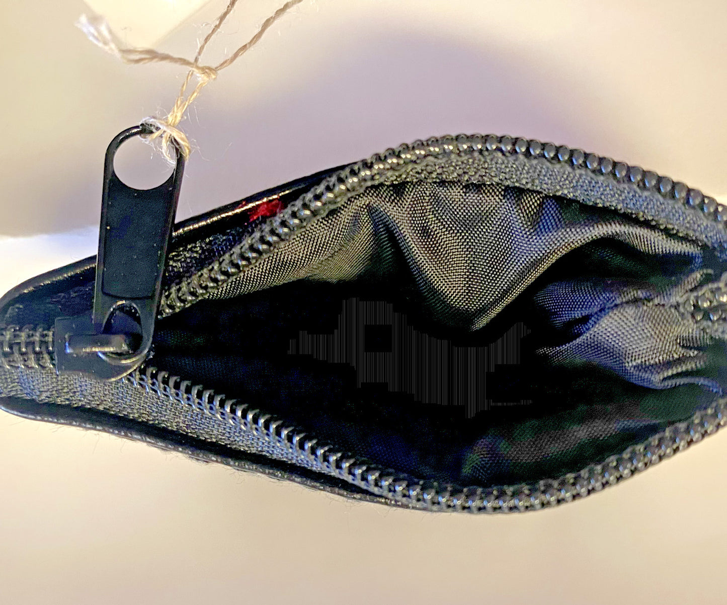 Black leather rosary pouch by Bob and Penny Lord Journeys of Faith, compact Christian accessory with stitched detailing.