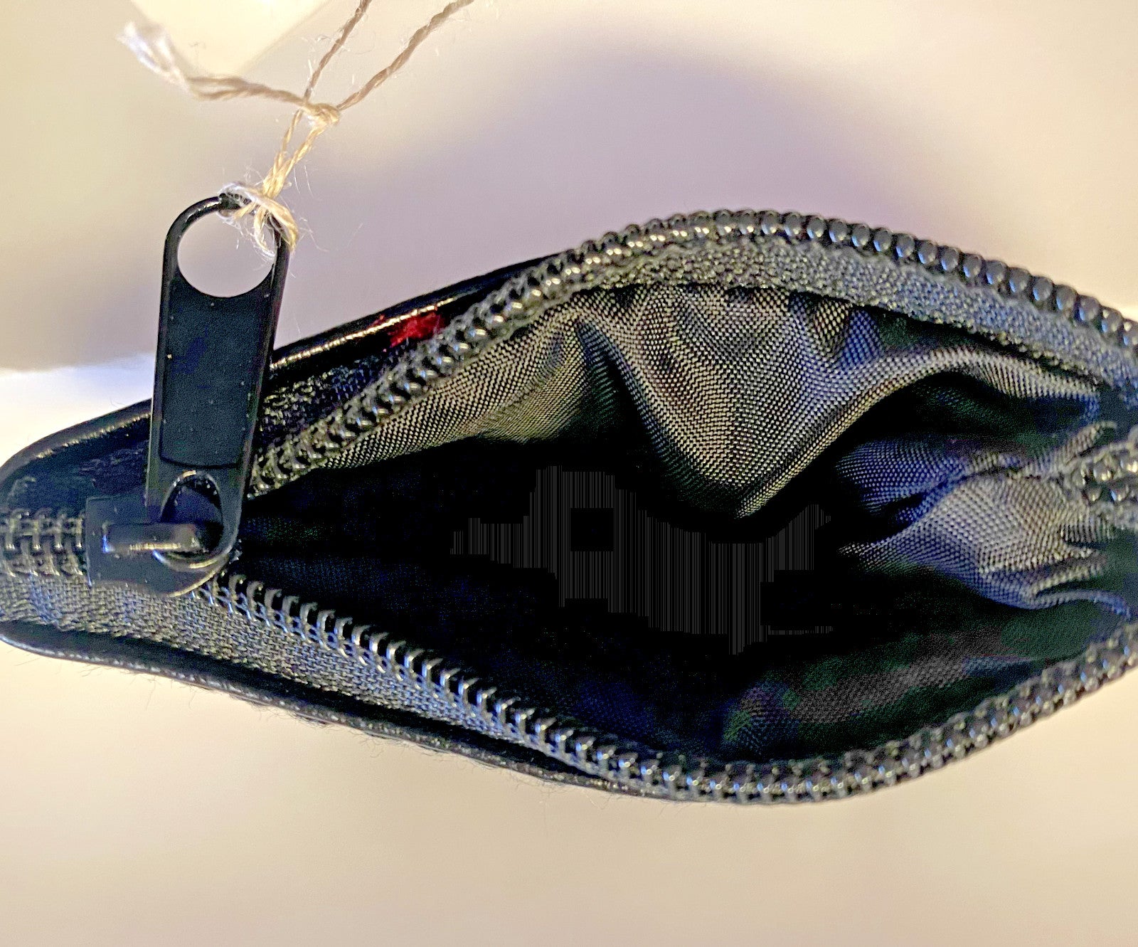 Black leather rosary pouch by Bob and Penny Lord Journeys of Faith, compact Christian accessory with stitched detailing.