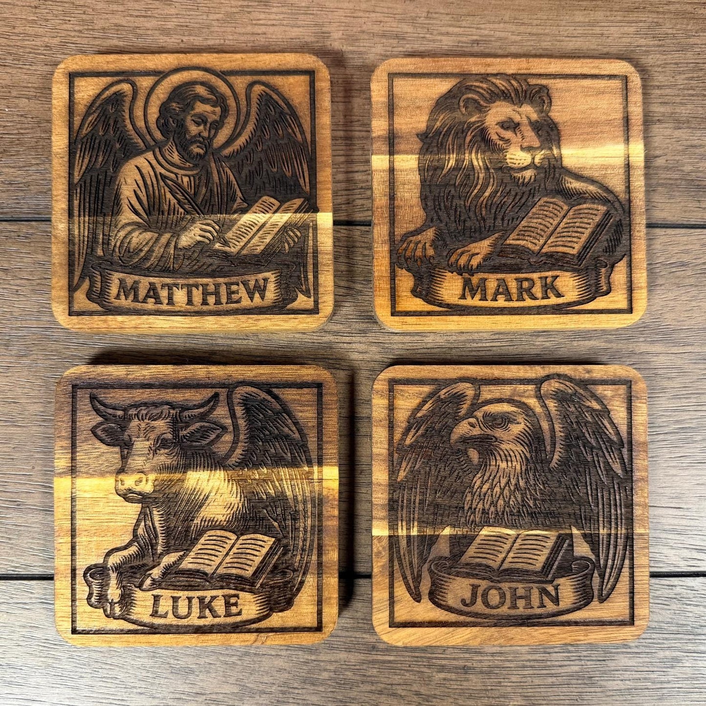 Wooden evangelist coaster set with religious Christian symbols, handcrafted by St. Augustine Prints.