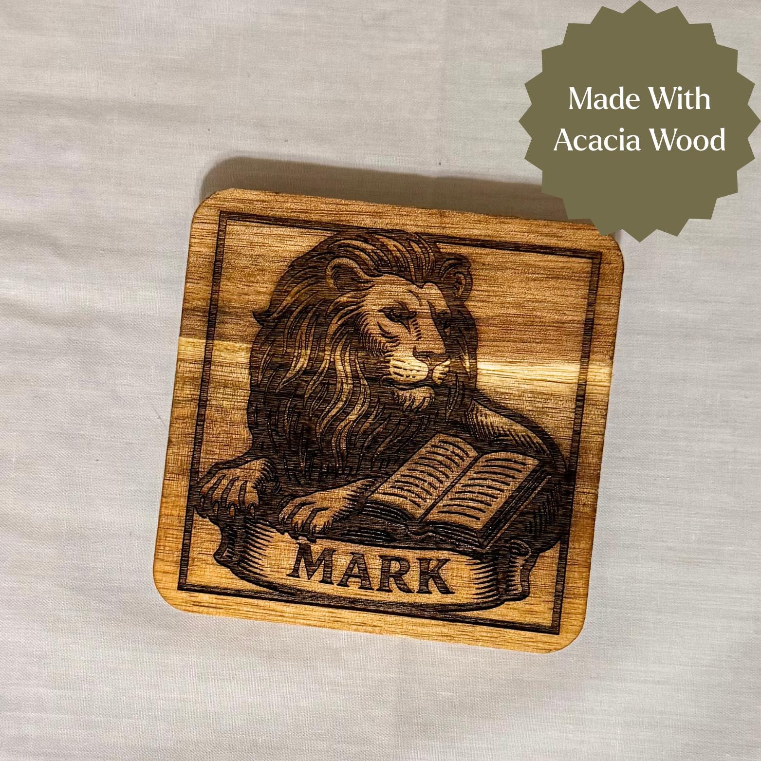 Wooden evangelist coaster set featuring religious Christian icons, crafted by St. Augustine Prints, with detailed engraved designs.