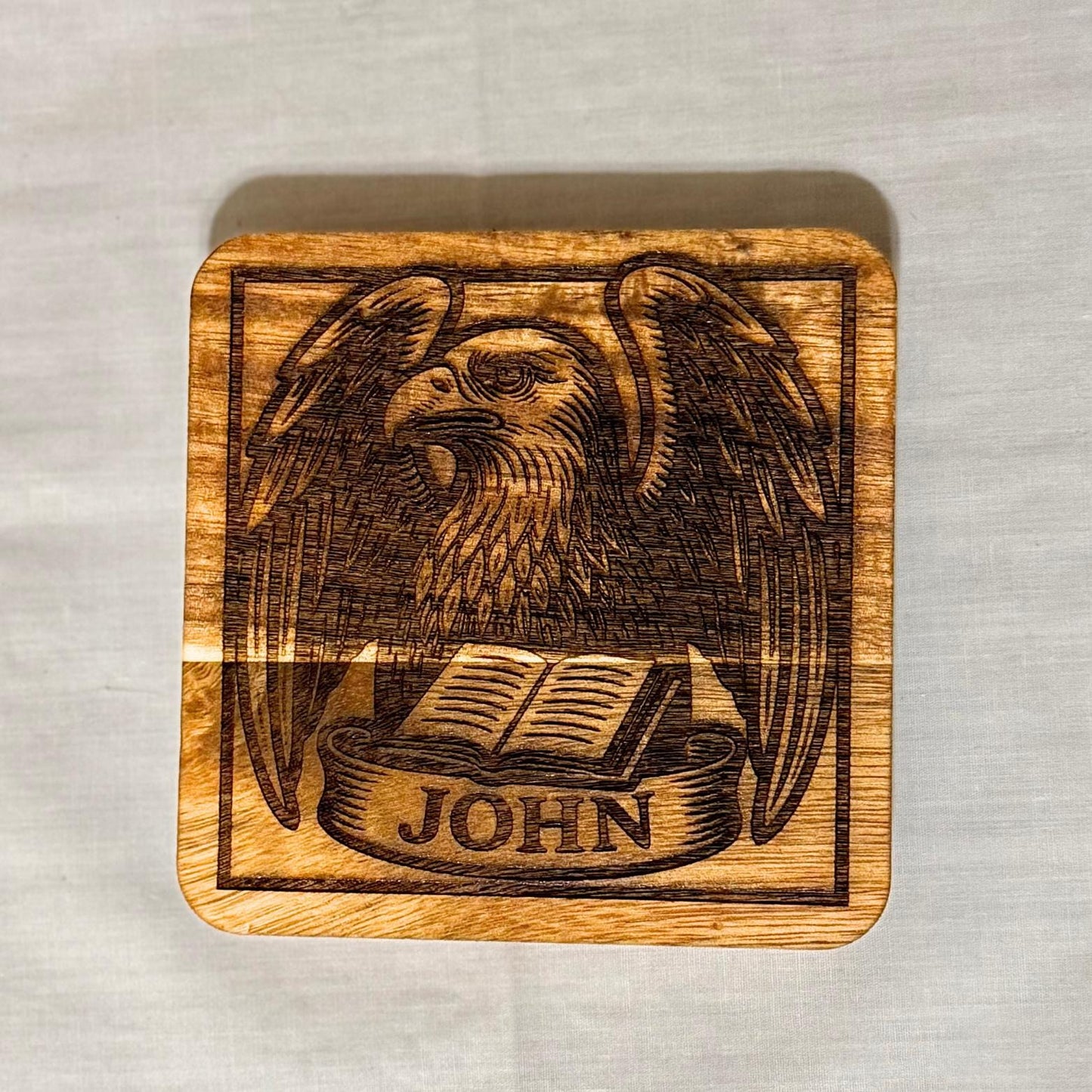 Set of wooden evangelist coasters with religious artwork, perfect for home decor or gifts, by St. Augustine Prints.
