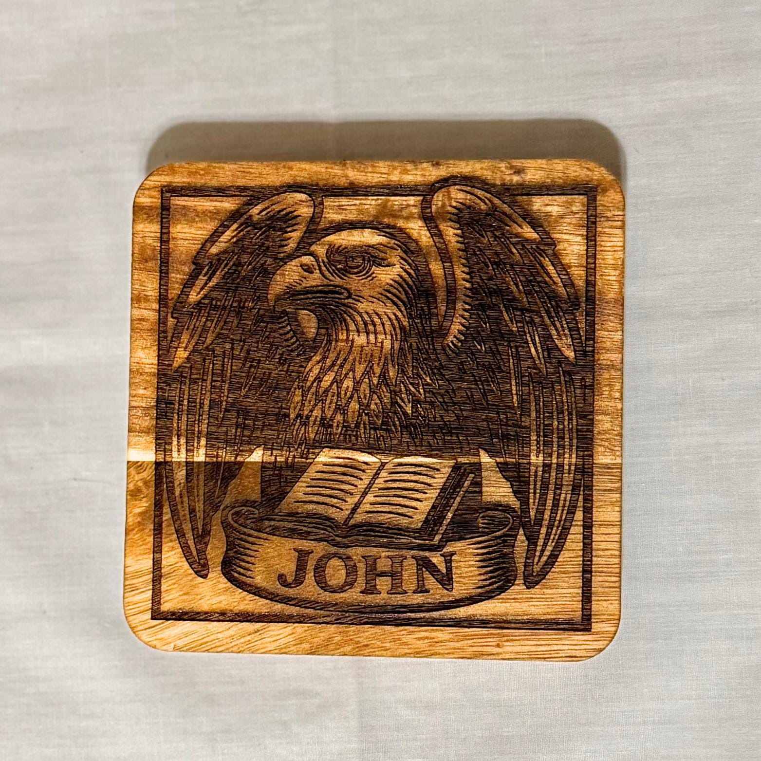 Set of wooden evangelist coasters with religious artwork, perfect for home decor or gifts, by St. Augustine Prints.