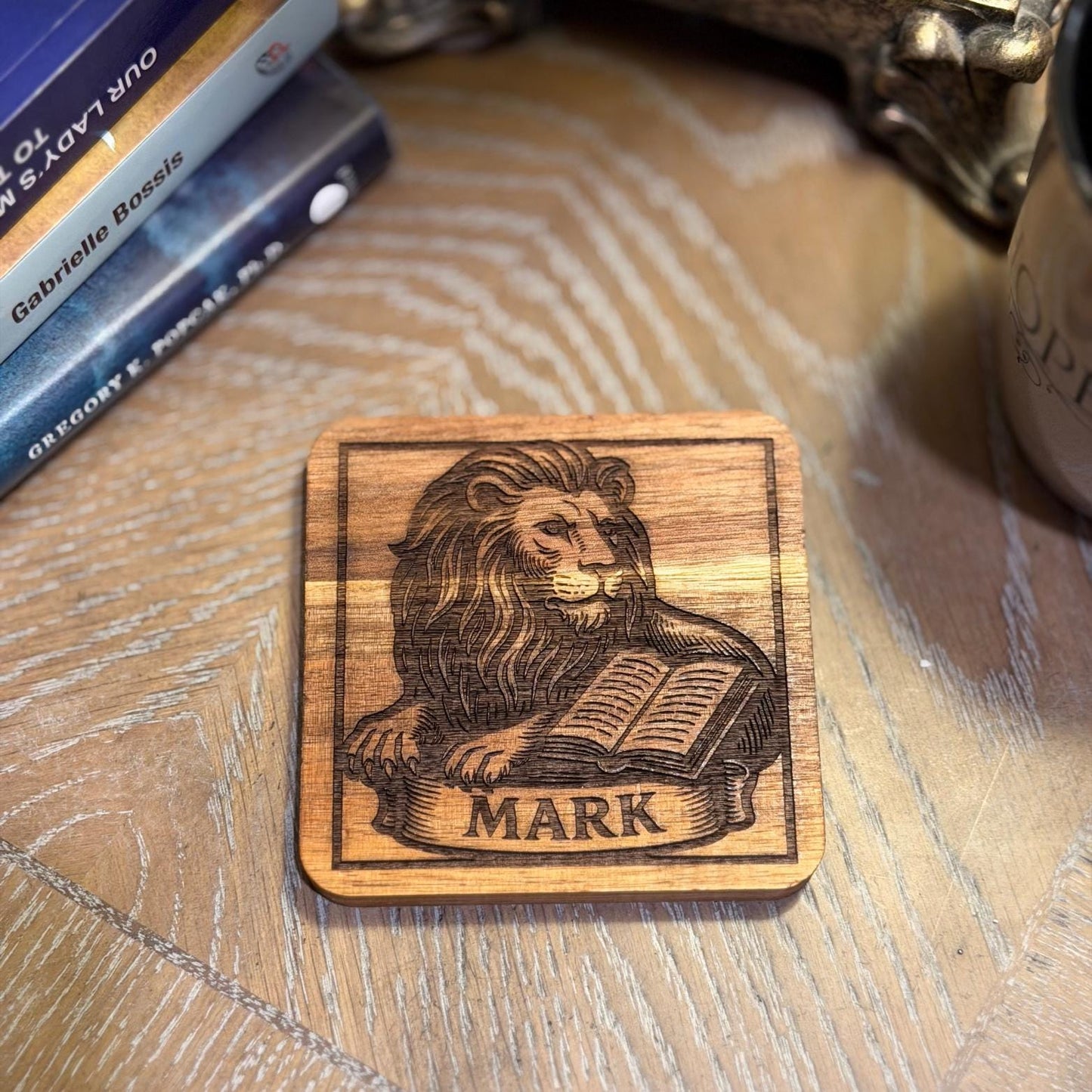 Wooden evangelist coaster set with religious Christian design, featuring St. Augustine Prints branding on handcrafted wooden coasters.