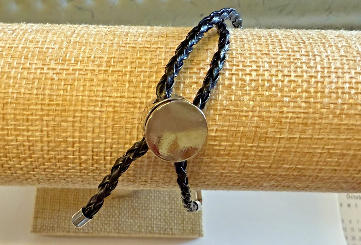 Silver tone cross bracelet with adjustable cord, Christian jewelry by Journeys of Faith, featuring a religious pendant and detailed design.
