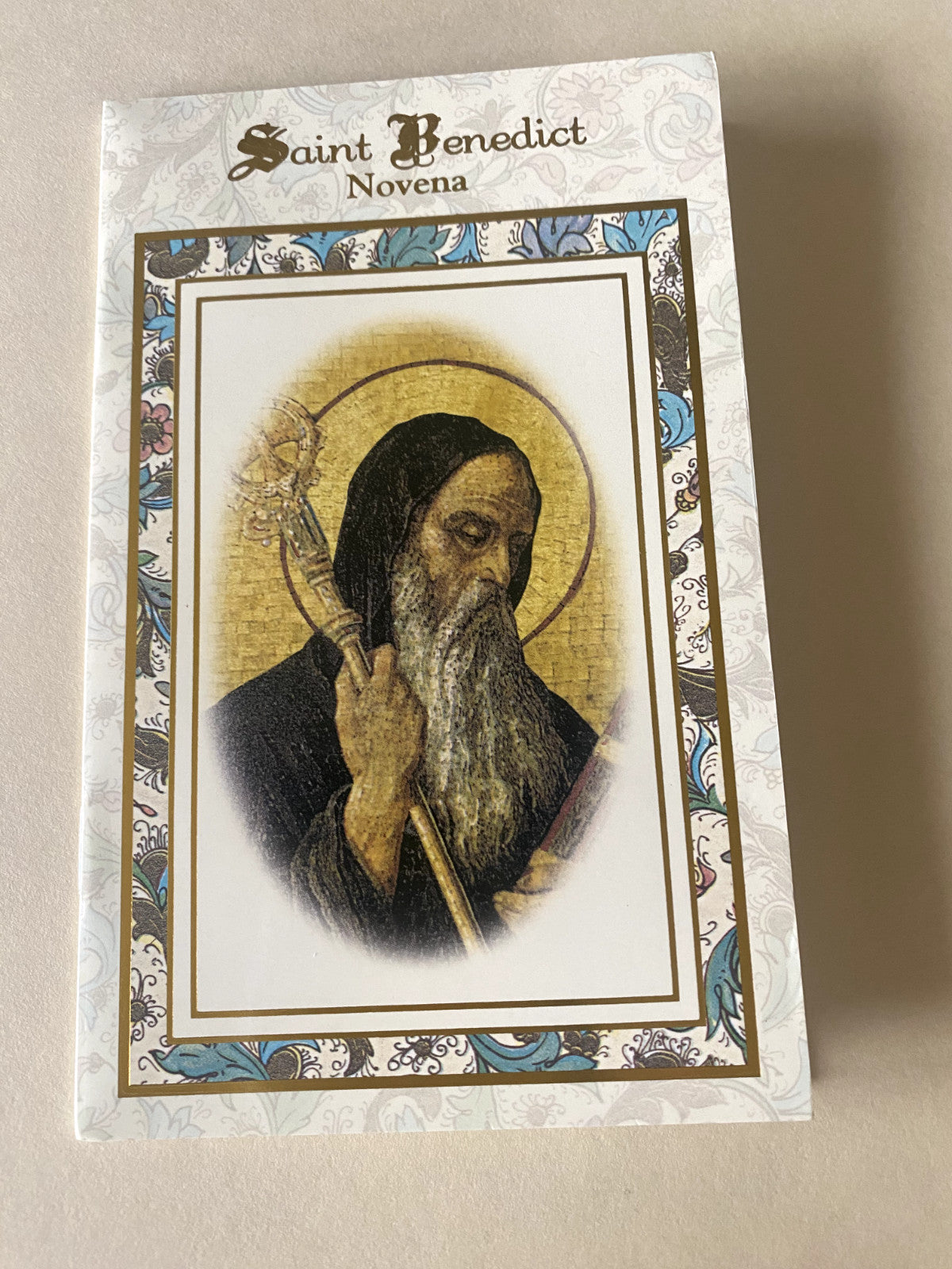 Saint Benedict Novena Holy Card from Bob and Penny Lord, featuring religious imagery and prayer text.