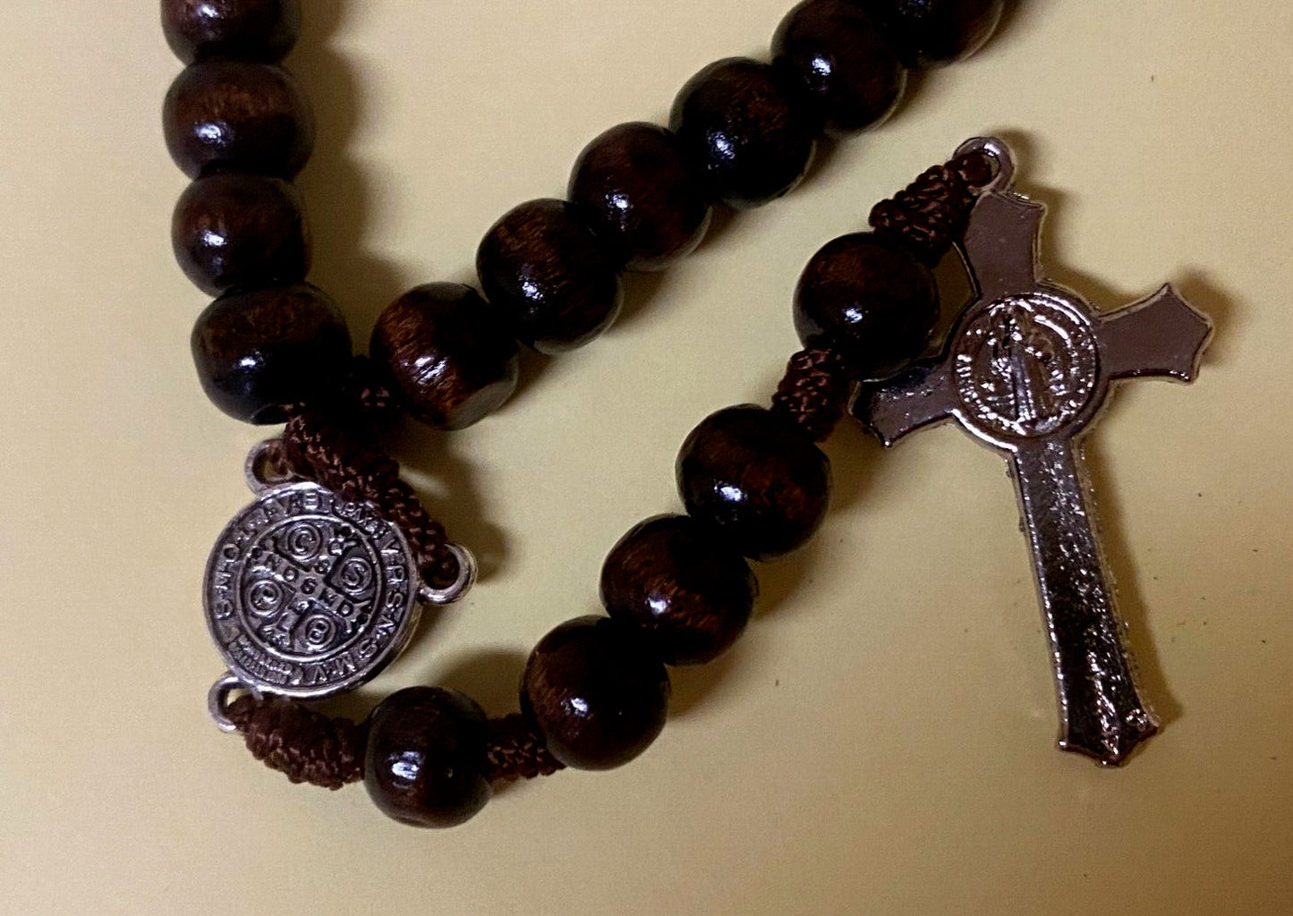 Wood rosary box with Infant of Prague figurine and rosary beads, collectible religious item from Colombia by Bob and Penny Lord.