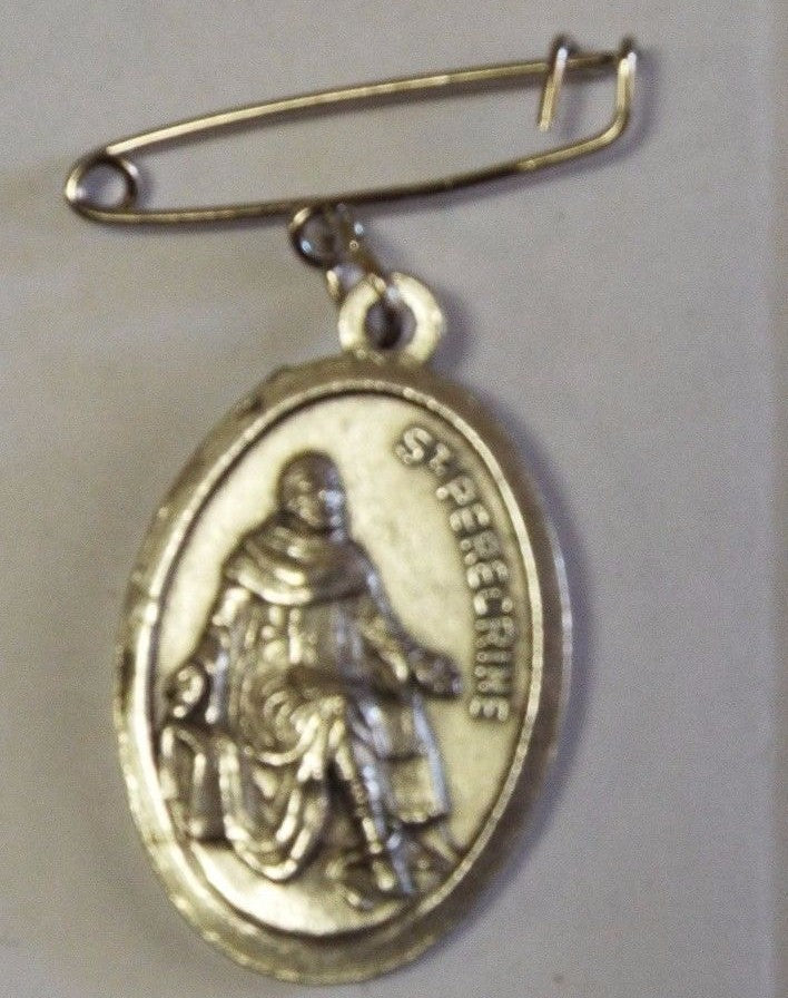 Saint Peregrine Cancer Saint medal with relic, religious collectible from Bob and Penny Lord, featuring detailed design and inscription.