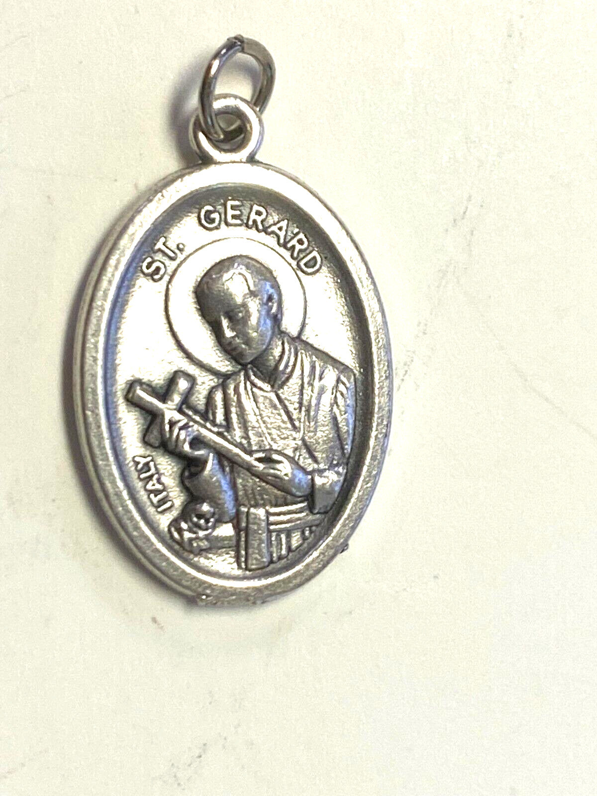 Silver tone Saint Gerard Majella and Our Lady of Perpetual Help medal from Bob and Penny Lord, detailed religious Christian jewelry.