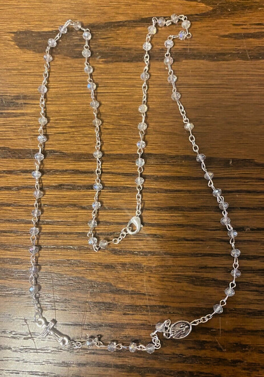 Divine Mercy clear glass beads rosary necklace with silver-tone medals, featuring religious Christian medal and detailed bead design.