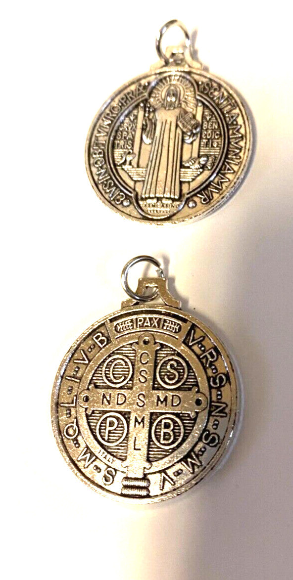 Large silver-tone Saint Benedict medal, 1.25 inches diameter, featuring religious imagery, from Bob and Penny Lord collectibles collection.