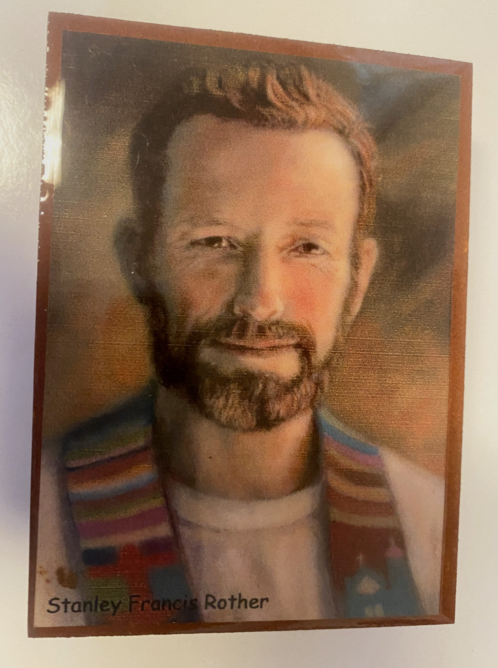 Wood rosary box with Christian rosary inside, featuring engraved details, from the Stanley Francis Rother collection by Bob and Penny Lord.