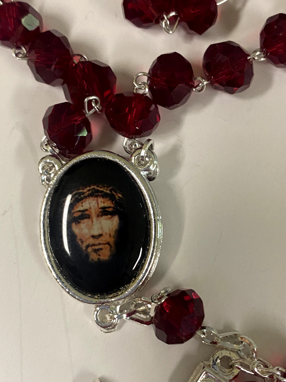 Handmade crucified Jesus Christ rosary with beads, crafted in Colombia, featuring religious Christian symbolism and intricate details.