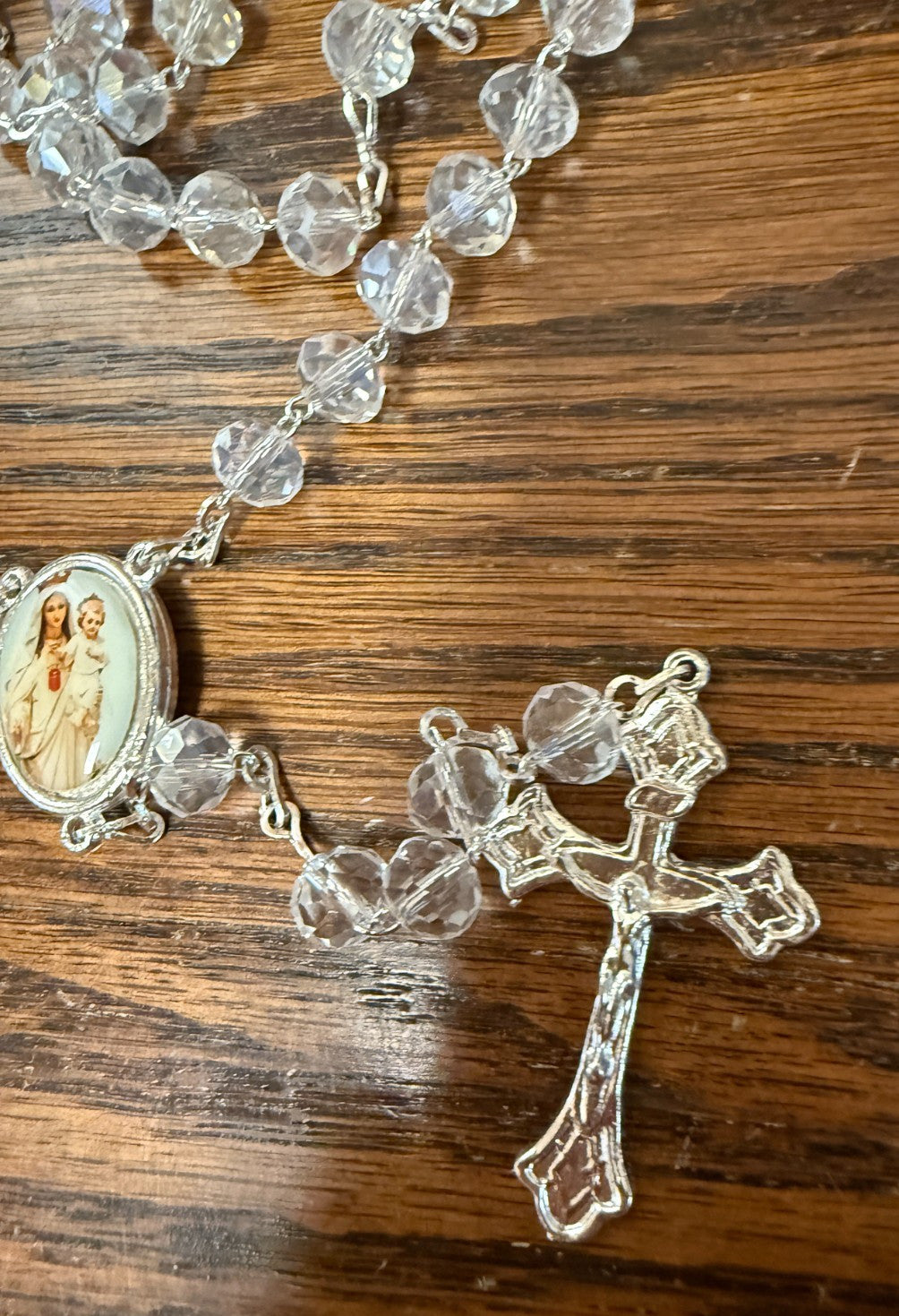 Iridescent beads handmade rosary with Catholic crucifix, crafted by Bob and Penny Lord, featuring colorful glass beads from Colombia.