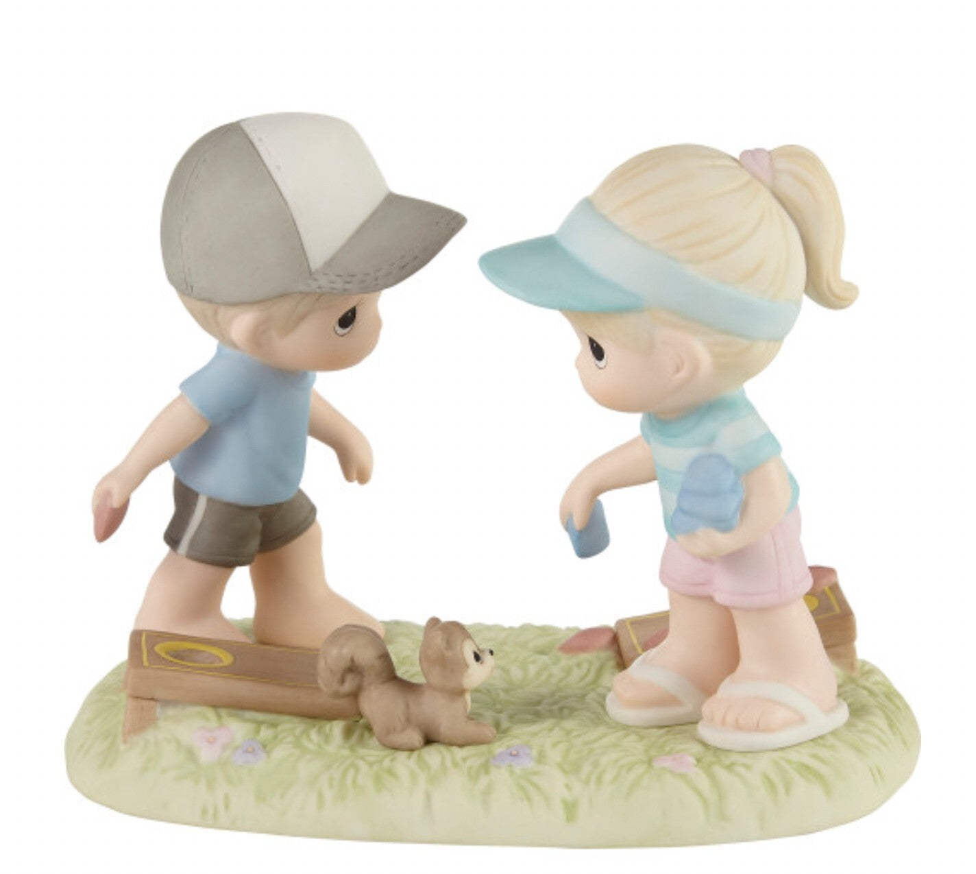 Precious Moments "Family Fun is Not Keeping Score" figurine, decorative collectible sculpture showing a family playing together.