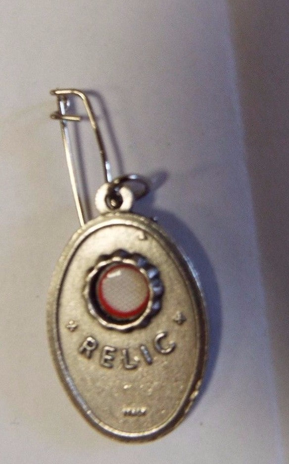 Saint Peregrine Cancer Saint medal relic from Bob and Penny Lord, featuring religious imagery and detailed craftsmanship.
