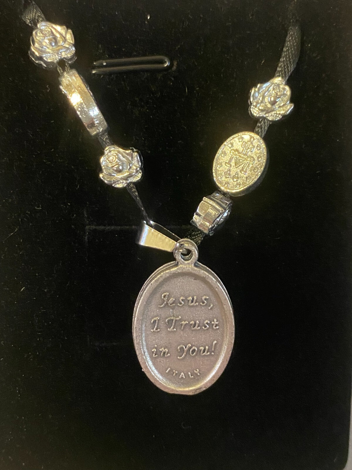 Art print of St. Michael, Divine Mercy, Miraculous Medal, Our Lady Guadalupe ribbon necklace by Journeys of Faith, featuring religious imagery.