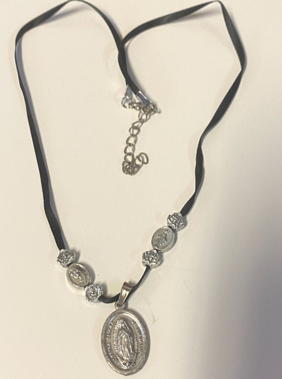 Art print of St. Michael, Divine Mercy, Miraculous Medal, and Our Lady Guadalupe ribbon necklace by Journeys of Faith.