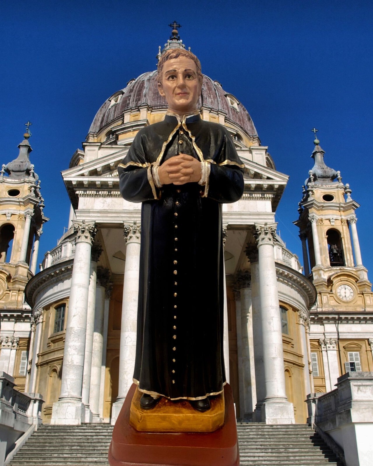 Saint John Bosco 8-inch religious statue from Colombia, depicting Don Bosco in traditional attire, collectible Christian figure by Bob and Penny Lord.