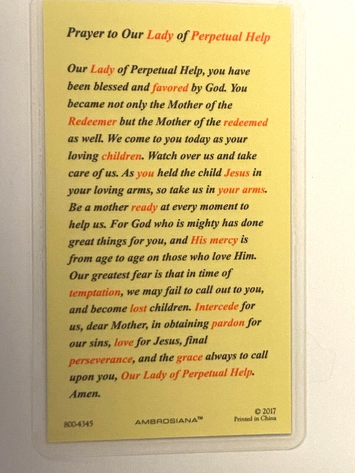 Laminated Our Lady of Perpetual Help prayer card by Bob and Penny Lord featuring religious imagery and Christian symbolism.