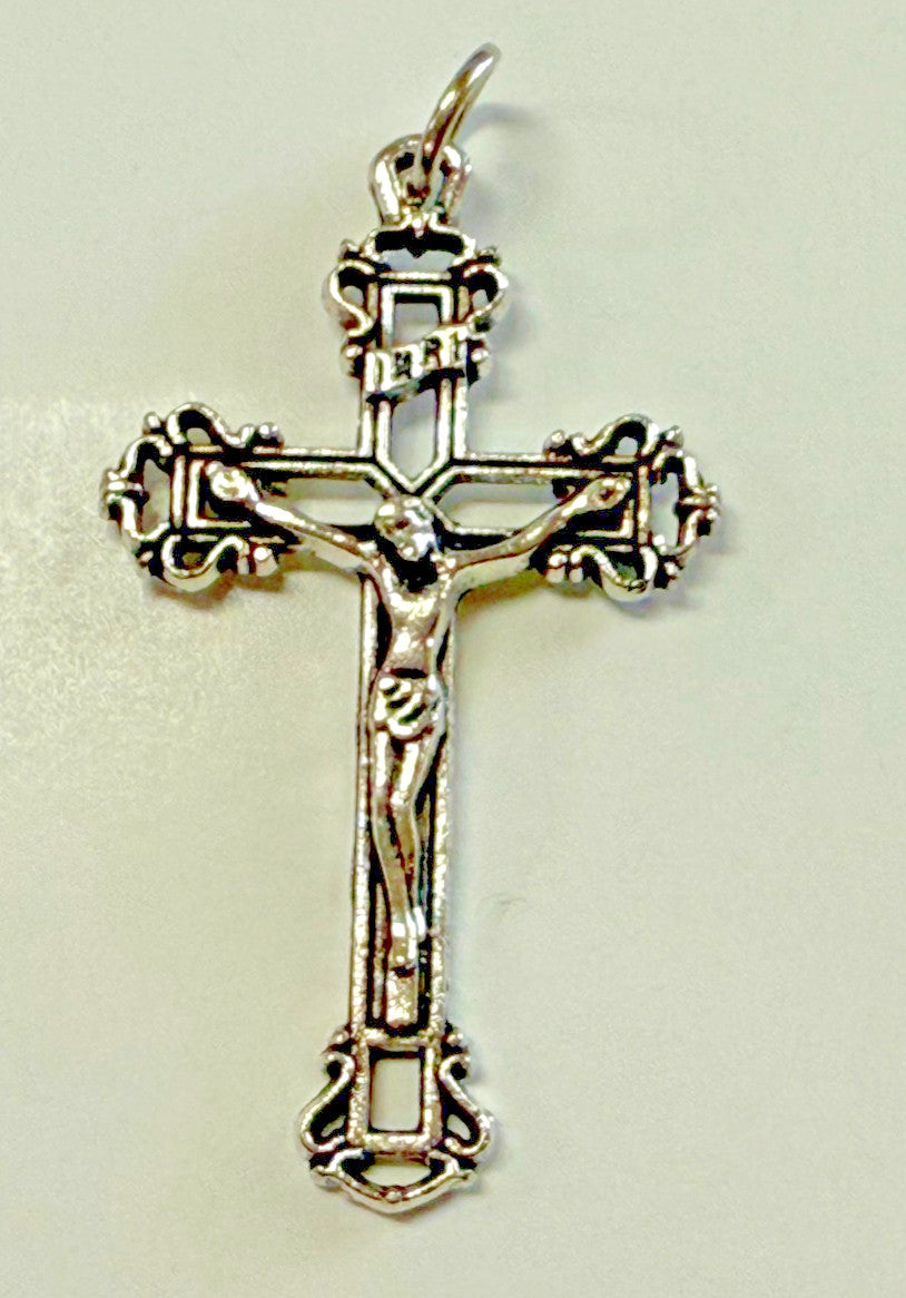 Silver plated Celtic crucifix pendant, 1.75 inches, featuring detailed Christian cross design, by Bob and Penny Lord.
