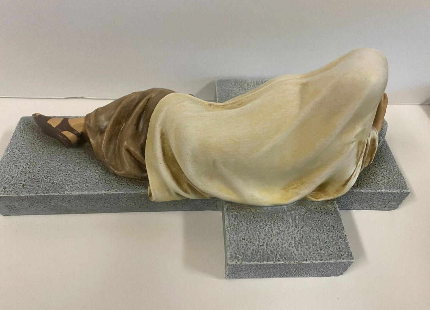 Imploring Jesus cross figurine by Bob and Penny Lord, detailed Christian crucifix collectible with religious imagery.