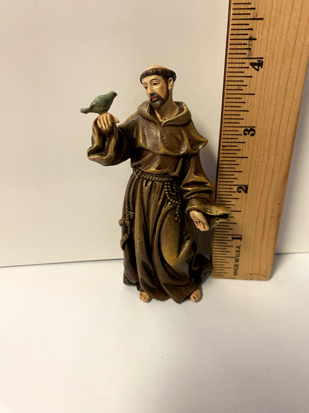 Small 4-inch Saint Francis of Assisi statue by Bob and Penny Lord, detailed Christian collectible figurine for religious display.