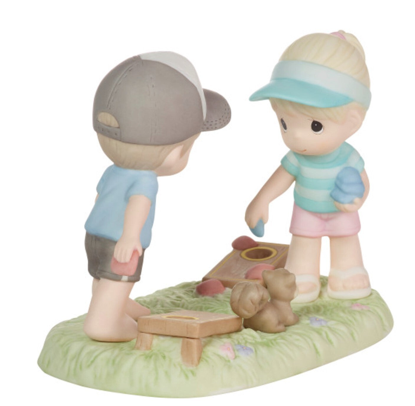 Precious Moments "Family Fun is Not Keeping Score" figurine, decorative collectible sculpture featuring a family enjoying a game together.