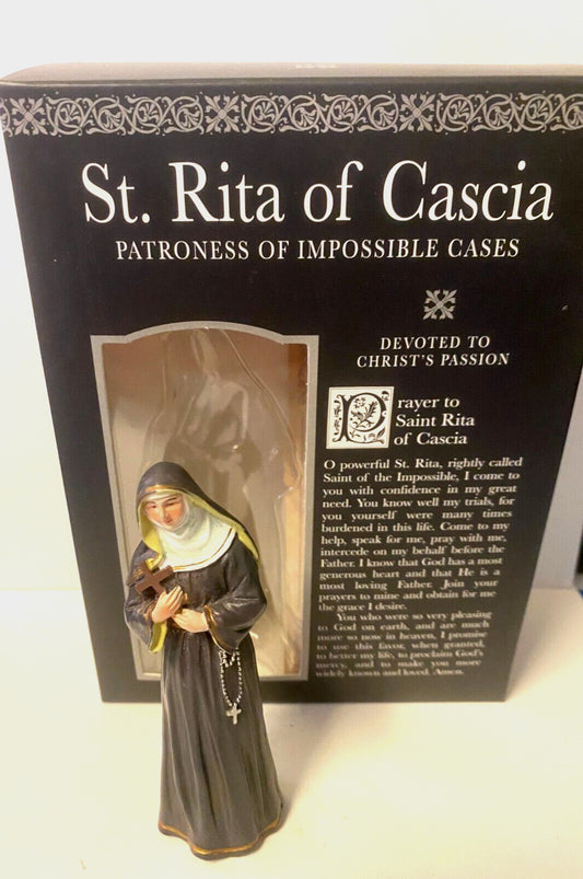 Small 3.75-inch Saint Rita of Cascia statue with prayer card and biography, part of Christian religious collectibles by Bob and Penny Lord.