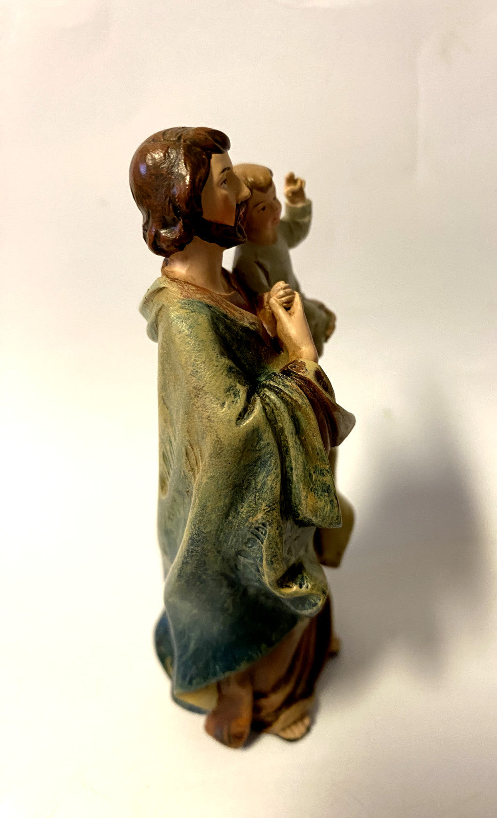 Saint Joseph with Child 4-inch statue by Bob and Penny Lord, depicting a detailed religious figurine of Saint Joseph holding the child.