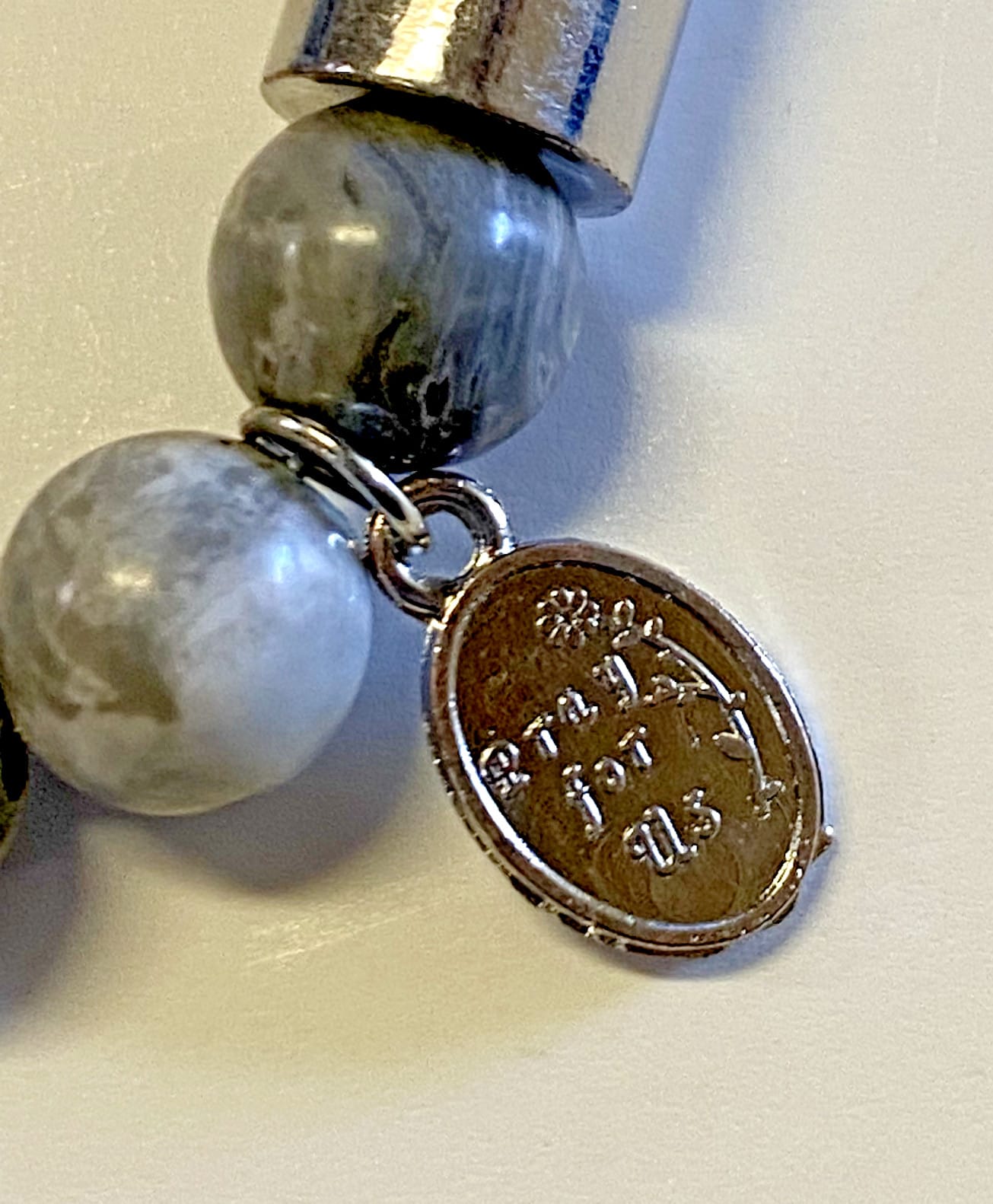 Padre Pio stone prayer bracelet with small charm, Christian jewelry from Journeys of Faith, spiritual and religious accessory.