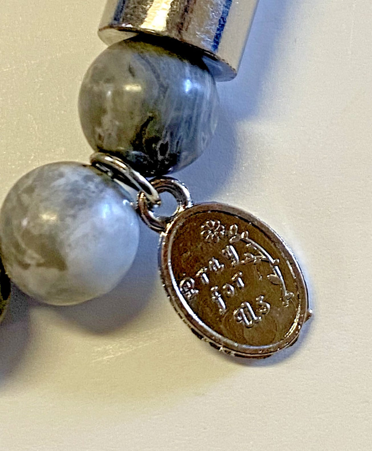 Padre Pio stone prayer bracelet with small charm, Christian jewelry from Journeys of Faith, spiritual and religious accessory.