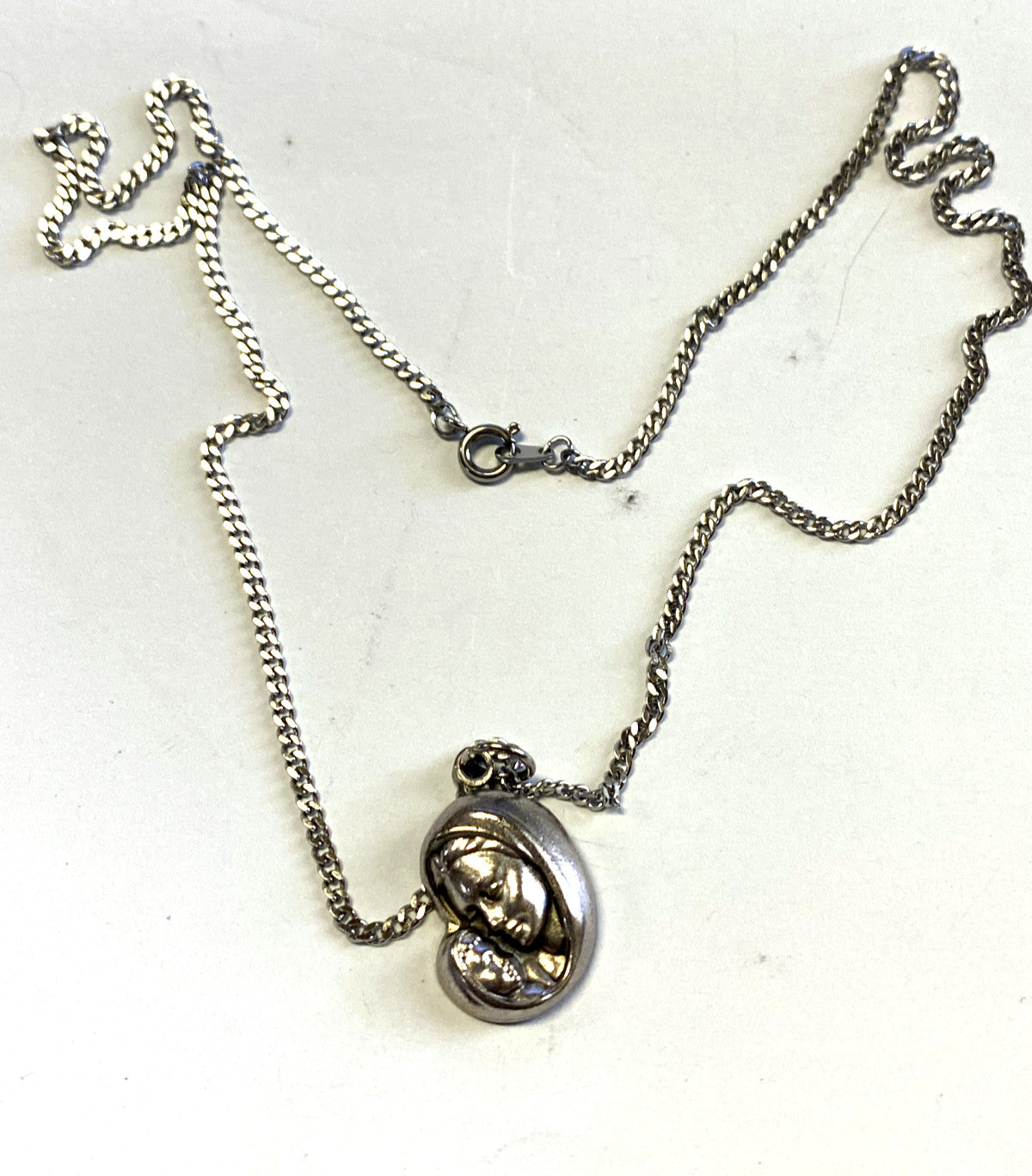Blessed Mother with Child pendant necklace, 20-inch fashion jewelry chain, silver-tone religious pendant on a simple chain.