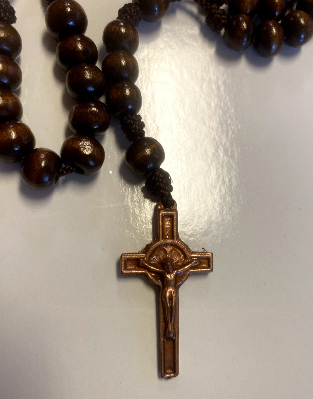 Wood rosary box with Saint Anthony of Padua figurine and rosary beads, featuring detailed craftsmanship, from Bob and Penny Lord.