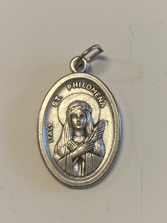 Silver Saint Philomena medal from Bob and Penny Lord, featuring religious imagery, designed for Christian collectibles and spirituality.