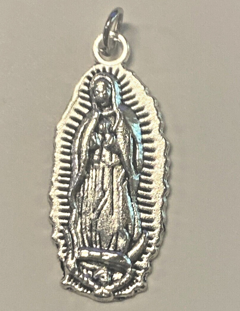 Silver plated Our Lady of Guadalupe medal, 1 inch, featuring religious imagery, from Bob and Penny Lord collectibles.