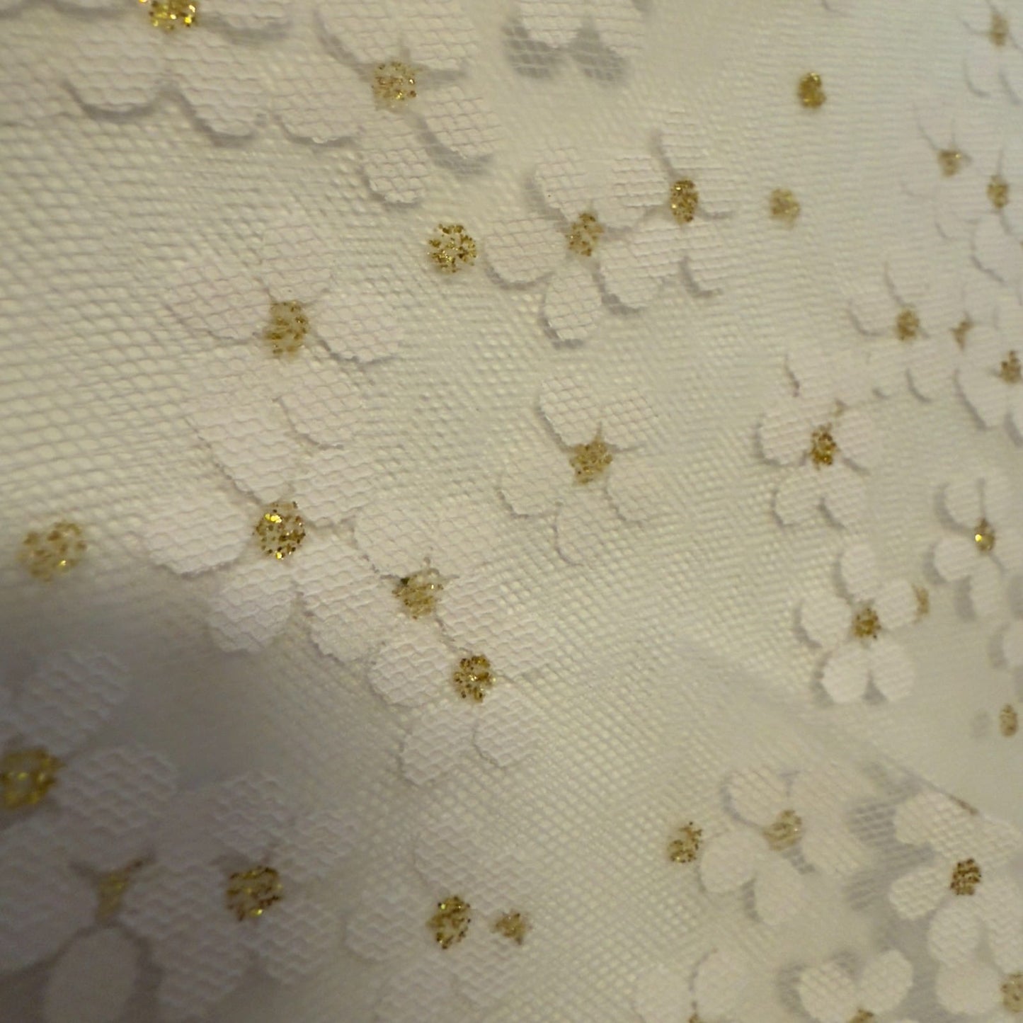 Women's white lace church veil with gold accents, elegant accessory for religious ceremonies and special occasions.