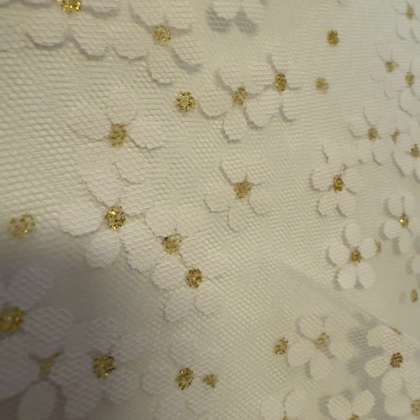 Women's white lace church veil with gold accents, elegant accessory for religious ceremonies and special occasions.
