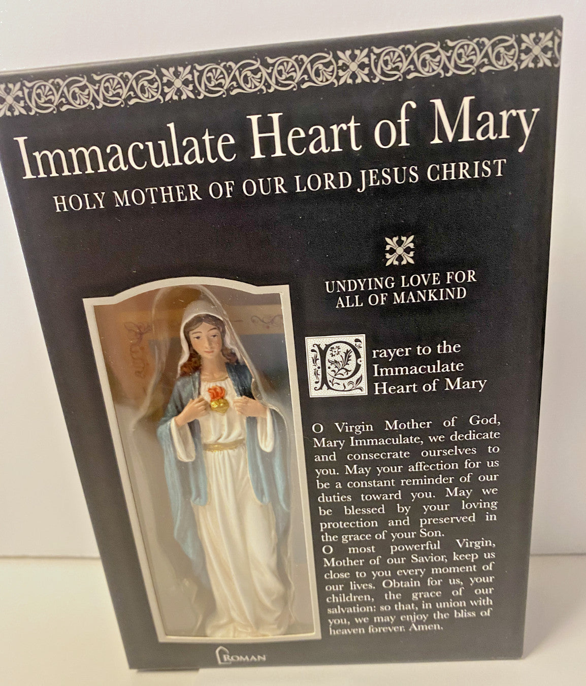 Small Immaculate Heart of Mary statue with prayer card and bio, crafted by Bob and Penny Lord, displayed with detailed religious features.