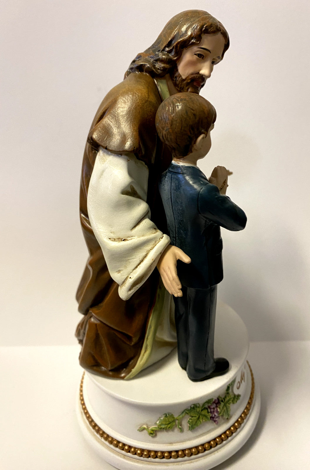 Roman Jesus with Boy Communion musical figurine, 7.25-inch sculpture depicting a religious scene for home decor.