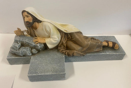 Imploring Jesus cross collectible by Bob and Penny Lord, featuring detailed religious crucifix design on a display stand.