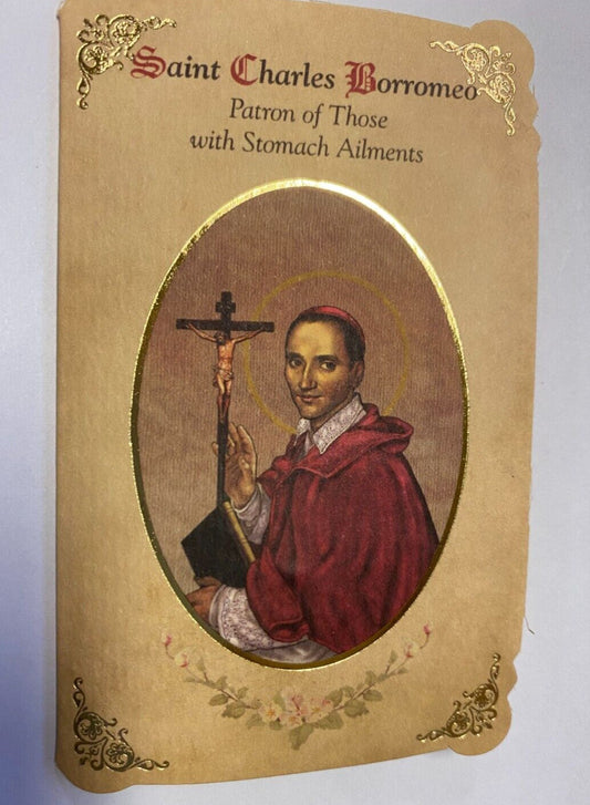 Saint Charles Borromeo prayer card and medal from Bob and Penny Lord, featuring religious imagery and detailed Christian design.