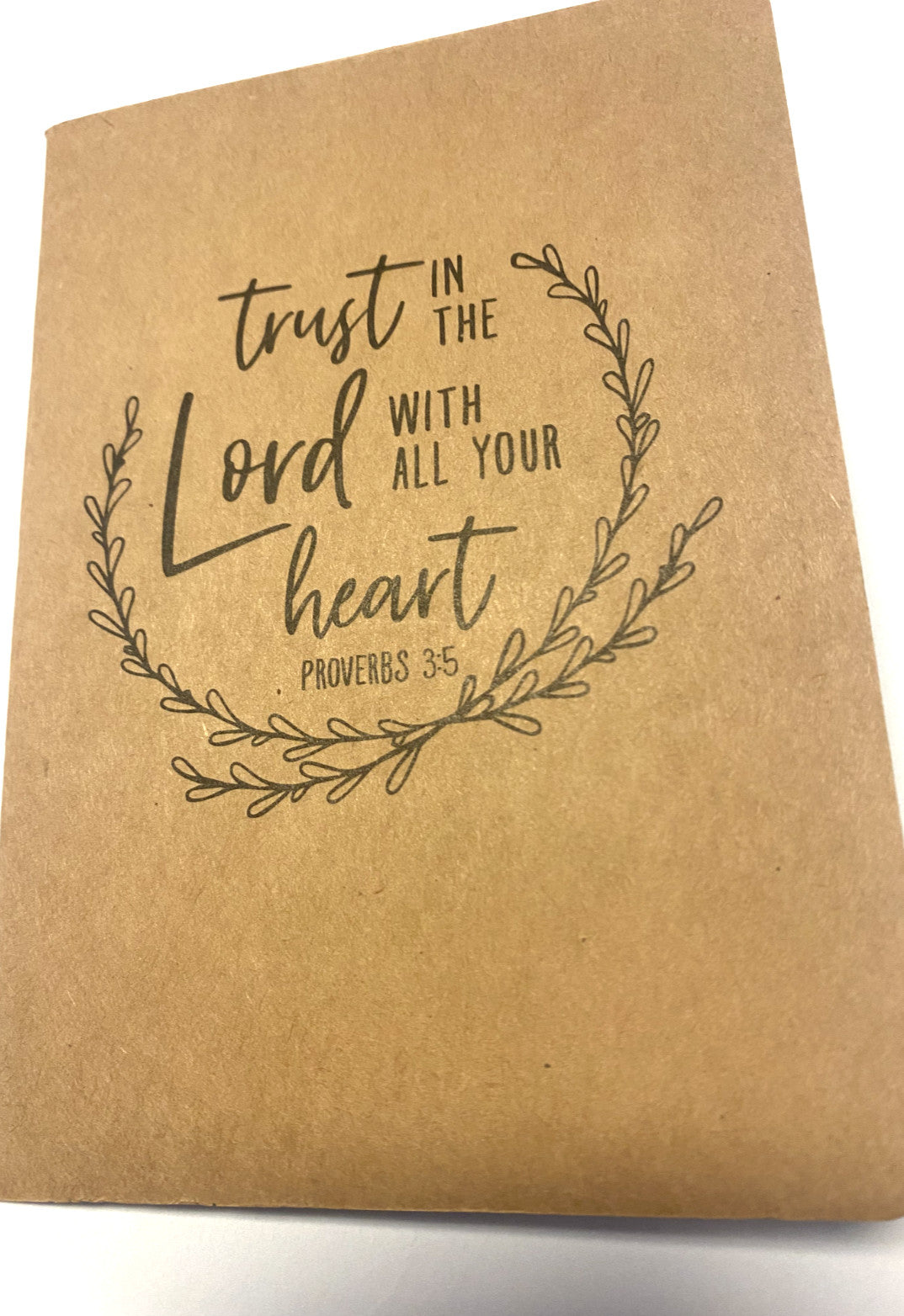 "Trust in the Lord Kraft 5.75-inch Christian notebook with religious design, by Bob and Penny Lord, featuring spiritual imagery."
