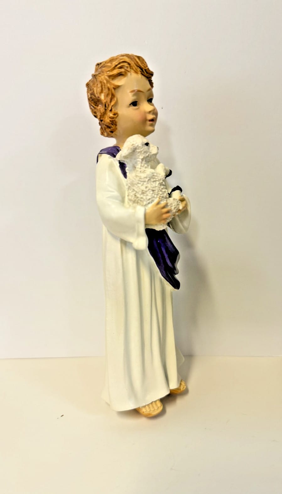 Boy Jesus with lamb figurine, 7-inch Christian religious statue by Journeys of Faith, depicting a young Jesus holding a lamb.