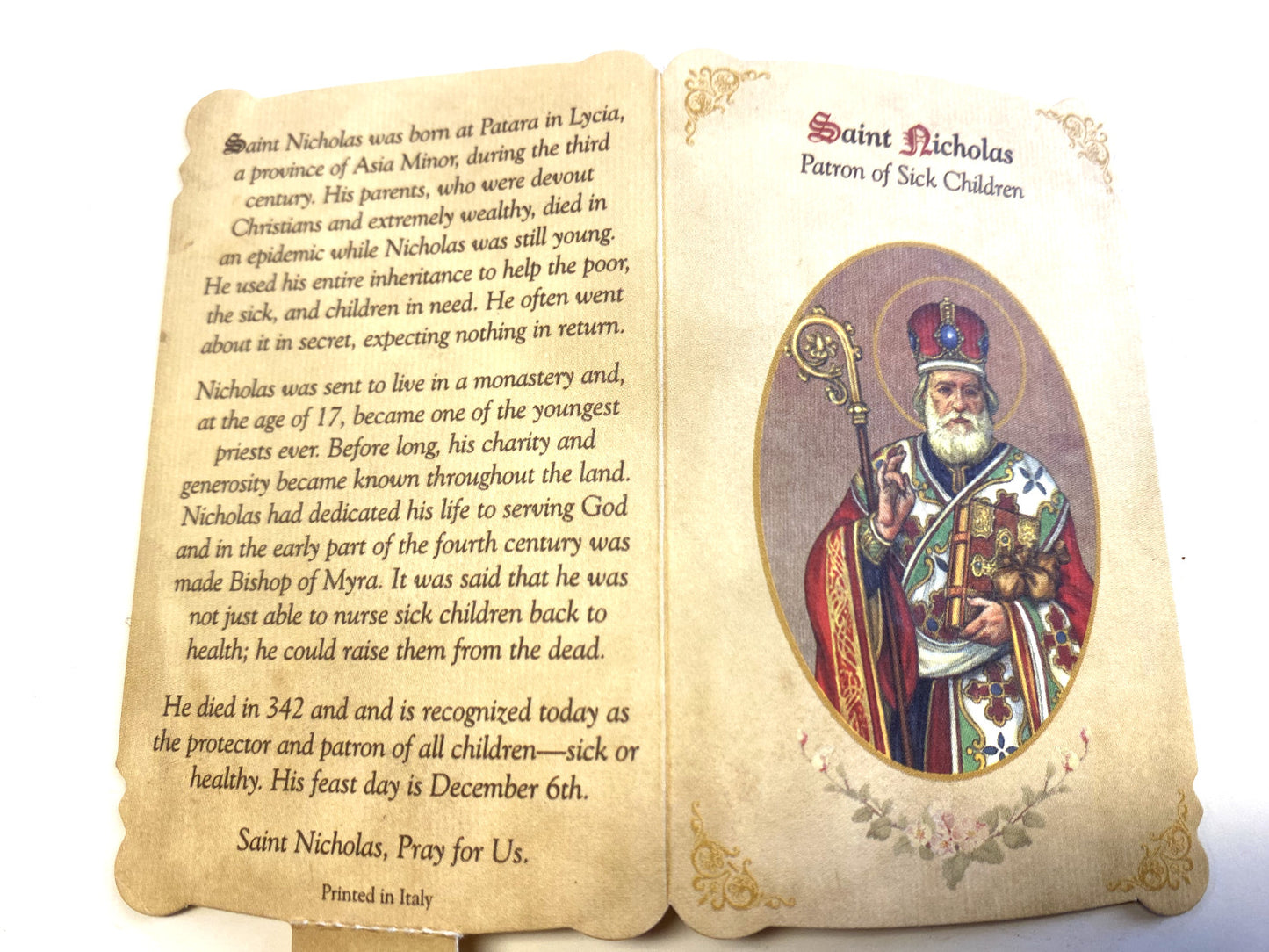 Saint Nicholas prayer folder with medal, Christian Holy Card by Bob and Penny Lord, featuring religious imagery of Patron Saint of Children.