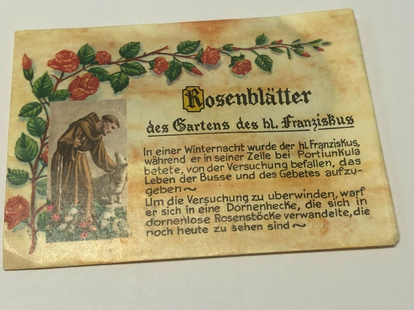 Vintage pack of Saint Francis of Assisi leaves from his rose garden collectible by Journeys of Faith, showing aged paper and botanical illustrations.