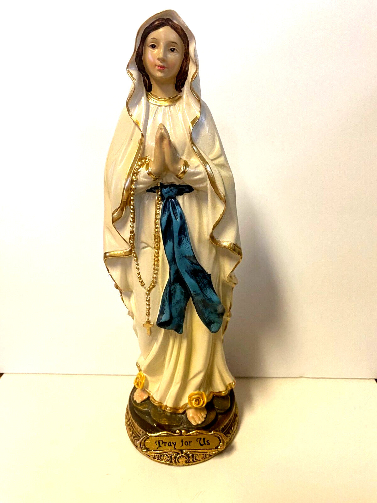 8-inch Our Lady of Lourdes resin statue by Journeys of Faith, depicting the religious figure with detailed craftsmanship.