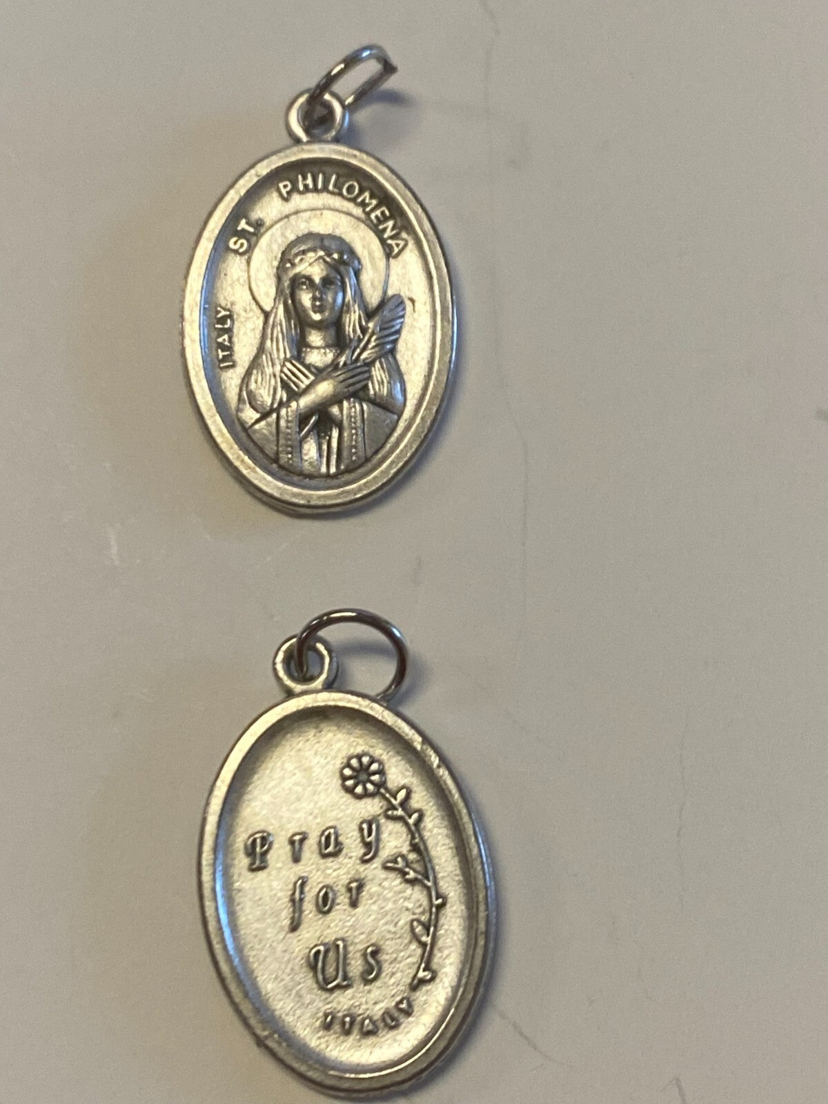 Silver Saint Philomena medal from Bob and Penny Lord, Christian religious medal with detailed religious imagery.
